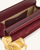 Holly Faux Suede Metal Pendant Embellished Clutch - Reddish Brown